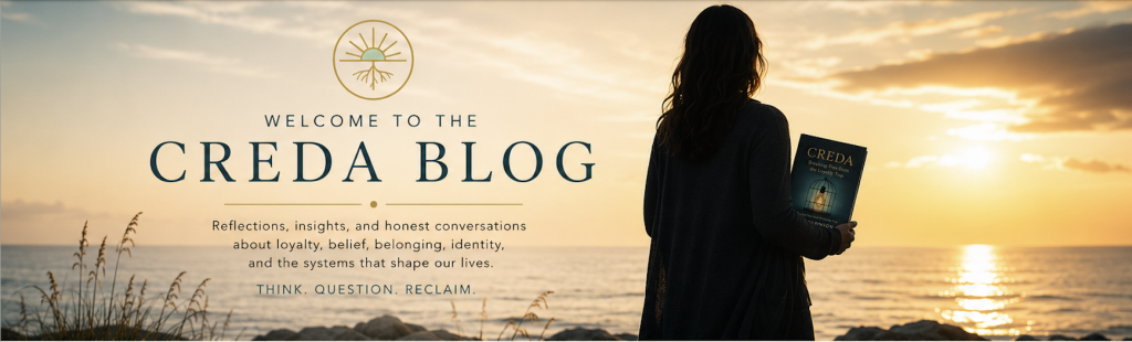 What is a Loyalty Trap? Silhouette of a woman holding the book Creda while standing by the ocean at sunset, featured banner for the Creda Blog.